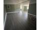 Spacious room with green walls and laminate flooring at 237 Charles Rd., Marion, SC 29571