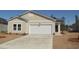 Charming single-story home featuring a spacious driveway and two-car garage in a suburban neighborhood at 248 Warner Crossing Way, Loris, SC 29569
