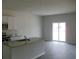 Bright, airy living area with modern finishes, an island, and sliding glass doors to the backyard at 252 Warner Crossing Way, Loris, SC 29569
