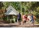 Scenic view of shoppers along the retail shops in the Market Common community at 252 Warner Crossing Way, Loris, SC 29569