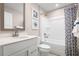 Clean bathroom featuring white cabinets, a tub, and blue-themed decor at 2521 Rowyn St., Longs, SC 29568