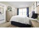 Bright bedroom with hardwood floors, neutral walls, and stylish decor at 2521 Rowyn St., Longs, SC 29568