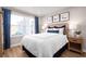 Comfortable bedroom featuring wood floors, large window, and stylish decorations for a relaxing ambiance at 2521 Rowyn St., Longs, SC 29568