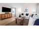 Cozy living room featuring stylish furniture, a patterned rug, and plenty of natural light at 2521 Rowyn St., Longs, SC 29568