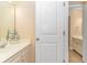 Half bath with white vanity and a decorative mirror at 2526 Great Scott Dr., Myrtle Beach, SC 29579