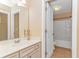 Bright bathroom with a vanity, toilet, and shower-tub combination at 2526 Great Scott Dr., Myrtle Beach, SC 29579