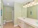 Bright bathroom with tile floors, white vanity, and a shower-tub combination at 2526 Great Scott Dr., Myrtle Beach, SC 29579