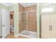 Shower room with neutral tile and white cabinets at 2526 Great Scott Dr., Myrtle Beach, SC 29579