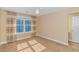 Bright bedroom featuring neutral walls, carpet flooring, a ceiling fan and natural light from large windows at 2526 Great Scott Dr., Myrtle Beach, SC 29579