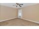 Neutral bedroom featuring a ceiling fan, plush carpet, and a bright window at 2526 Great Scott Dr., Myrtle Beach, SC 29579