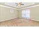 Spacious bedroom featuring a trey ceiling with fan and large window at 2526 Great Scott Dr., Myrtle Beach, SC 29579
