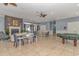 Spacious clubhouse with a cozy fireplace, comfortable seating, and a pool table for residents to enjoy at 2526 Great Scott Dr., Myrtle Beach, SC 29579