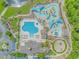Aerial view of community pool with water park, playground, and sunbathing area at 2526 Great Scott Dr., Myrtle Beach, SC 29579