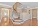 Welcoming entryway with hardwood floors, staircase and open floor plan to the rest of the house at 2526 Great Scott Dr., Myrtle Beach, SC 29579