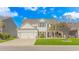 Charming two-story white home with a manicured lawn, a two car garage, and inviting curb appeal at 2526 Great Scott Dr., Myrtle Beach, SC 29579