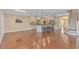 Spacious living room with hardwood flooring, adjacent to the kitchen with bar stool seating and dining area at 2526 Great Scott Dr., Myrtle Beach, SC 29579