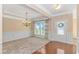 Bright, spacious living room with neutral tones, decorative molding, and large windows with natural light at 2526 Great Scott Dr., Myrtle Beach, SC 29579