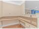 Home office with a built-in desk area, overhead lighting, and hardwood flooring at 2526 Great Scott Dr., Myrtle Beach, SC 29579