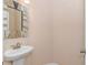 Elegant powder room with a decorative mirror and pedestal sink at 2526 Great Scott Dr., Myrtle Beach, SC 29579