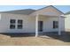 Rear view of home featuring covered patio and vinyl siding at 260 Warner Crossing Way, Loris, SC 29569