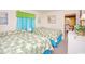 Bedroom with two beds, tropical-themed bedding, and bright sheer curtains at 2602 Perrin Dr., North Myrtle Beach, SC 29582