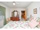 Bright bedroom features neutral walls, wood furniture, and colorful bedding at 2602 Perrin Dr., North Myrtle Beach, SC 29582