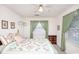 Bedroom with a floral quilt, dark wood dresser, and natural light entering through two windows at 2602 Perrin Dr., North Myrtle Beach, SC 29582