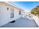 Bright and sunny outdoor deck with white railings and a view of the neighborhood at 2602 Perrin Dr., North Myrtle Beach, SC 29582