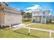 Back view of two story home, shed, privacy fence and lawn at 2602 Perrin Dr., North Myrtle Beach, SC 29582