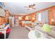 Cozy living room featuring wood paneling, neutral carpet, and comfortable seating at 2602 Perrin Dr., North Myrtle Beach, SC 29582