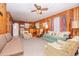 Open-concept living space with wood paneling, a sofa, and a view into the kitchen area at 2602 Perrin Dr., North Myrtle Beach, SC 29582