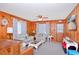 Comfortable living room with cozy seating, wood paneling, and plenty of natural light at 2602 Perrin Dr., North Myrtle Beach, SC 29582