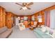 Retro living room with wood paneling, vintage furniture, and an open floor plan to the kitchen at 2602 Perrin Dr., North Myrtle Beach, SC 29582