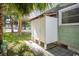 Side yard featuring an outdoor shower with an adjacent staircase and lush green lawn at 2602 Perrin Dr., North Myrtle Beach, SC 29582