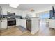 Kitchen features white cabinets, stainless steel appliances, and opens up to the dining and living areas at 2701 S Ocean Blvd. # 1908, North Myrtle Beach, SC 29582