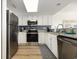 Bright kitchen with stainless steel appliances, white cabinetry, and granite countertops at 2701 S Ocean Blvd. # 1908, North Myrtle Beach, SC 29582