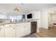Kitchenette features white cabinetry, granite countertops, stainless steel appliances, and access to a bathroom at 2701 S Ocean Blvd. # 1908, North Myrtle Beach, SC 29582