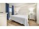 Bright bedroom with hardwood floors, a large bed and lots of natural light at 2701 S Ocean Blvd. # 1908, North Myrtle Beach, SC 29582