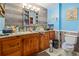 Bathroom with blue accent wall and wood-look accent wall with light-colored floor tiles at 2945 Old Railroad Rd., Conway, SC 29527