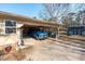 Carport featuring a blue truck, storage space, and a well-maintained driveway, adding convenience and practicality at 2945 Old Railroad Rd., Conway, SC 29527