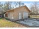 Detached garage features a white garage door, ample storage, and a side entrance at 2945 Old Railroad Rd., Conway, SC 29527