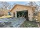 Detached garage with open doors revealing ample workspace, featuring outdoor access, and storage options at 2945 Old Railroad Rd., Conway, SC 29527