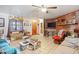 Relaxing living room with a cozy brick fireplace, tiled floors, and comfortable seating at 2945 Old Railroad Rd., Conway, SC 29527