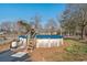 Backyard above ground pool, surrounded by landscaping, perfect for summer relaxation at 2945 Old Railroad Rd., Conway, SC 29527