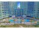 Aerial view of resort with beachfront access, pools, lounge seating, and lush landscaping at 300 N Ocean Blvd. # 1026, North Myrtle Beach, SC 29582