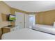 This bedroom features two beds, a TV, and a closet for plenty of storage at 300 N Ocean Blvd. # 1026, North Myrtle Beach, SC 29582