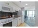 Efficient kitchen with stainless steel appliances seamlessly connected to the living and dining area at 300 N Ocean Blvd. # 1026, North Myrtle Beach, SC 29582