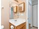 Bright bathroom featuring a vanity with storage, a mirror, and neutral wall color at 310 Junco Circle, Longs, SC 29568