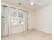 Bedroom with neutral walls, a window with curtains, and a view of the neighborhood at 310 Junco Circle, Longs, SC 29568