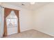 Bedroom with neutral walls, a window with curtains, and a glimpse of the exterior at 310 Junco Circle, Longs, SC 29568